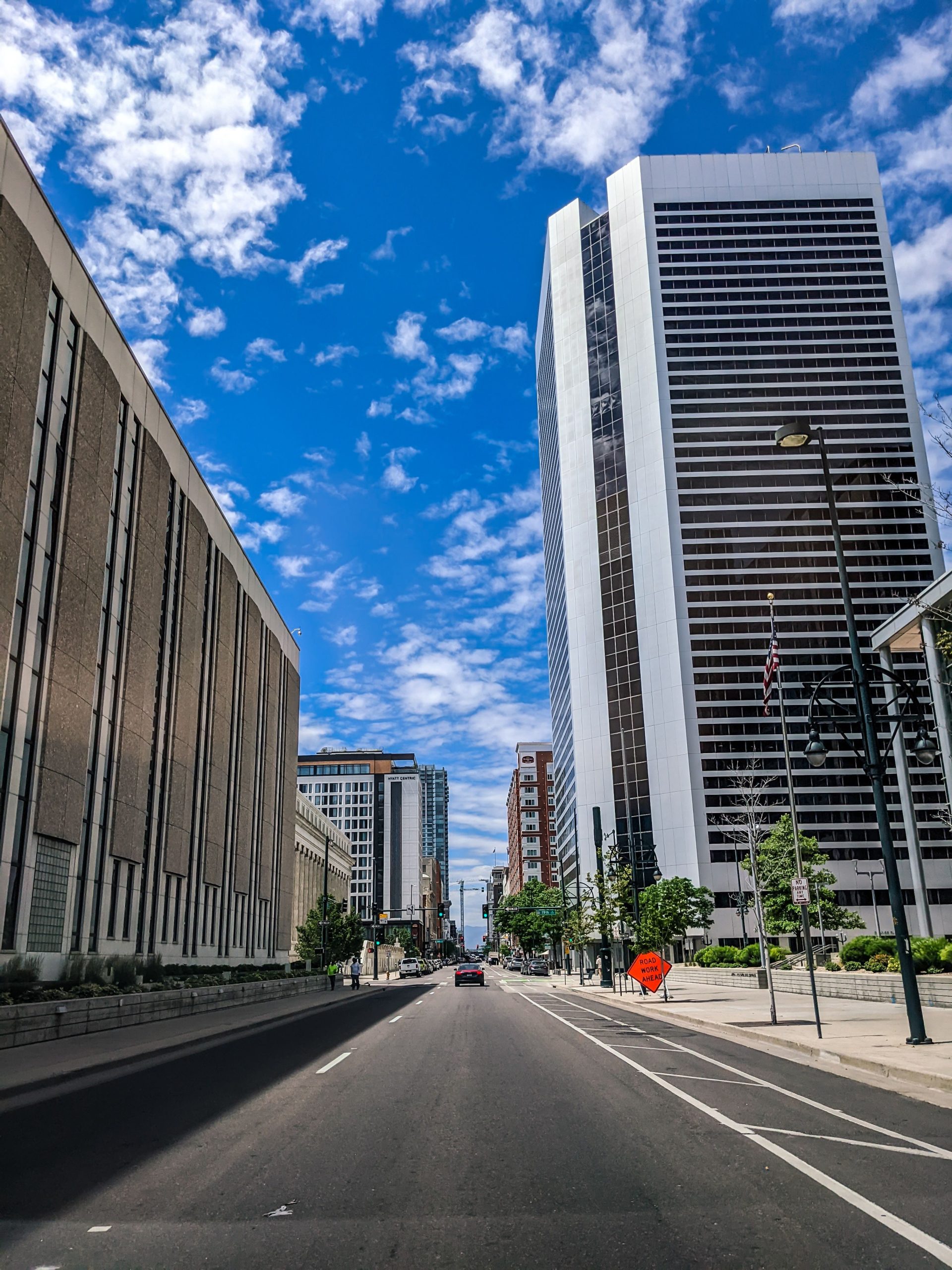 Explore the vibrant urban skyline of downtown Denver, showcasing modern skyscrapers against a clear blue sky.
